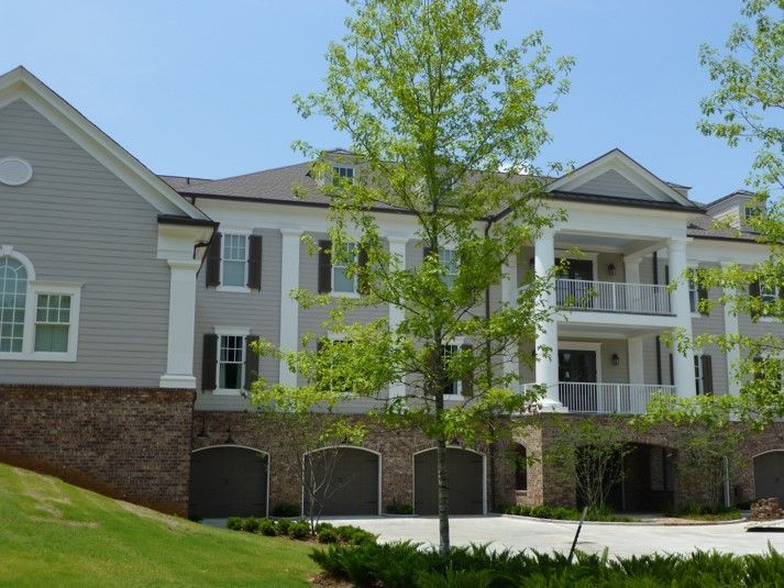 A large house with a tree in front of it