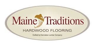 The maine traditions hardwood flooring logo is on a white background.