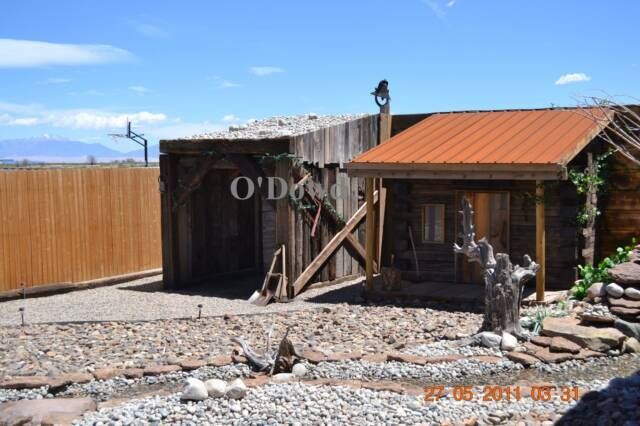 stone landscaping and wooden shelter