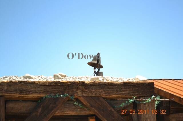 bell on wooden roof