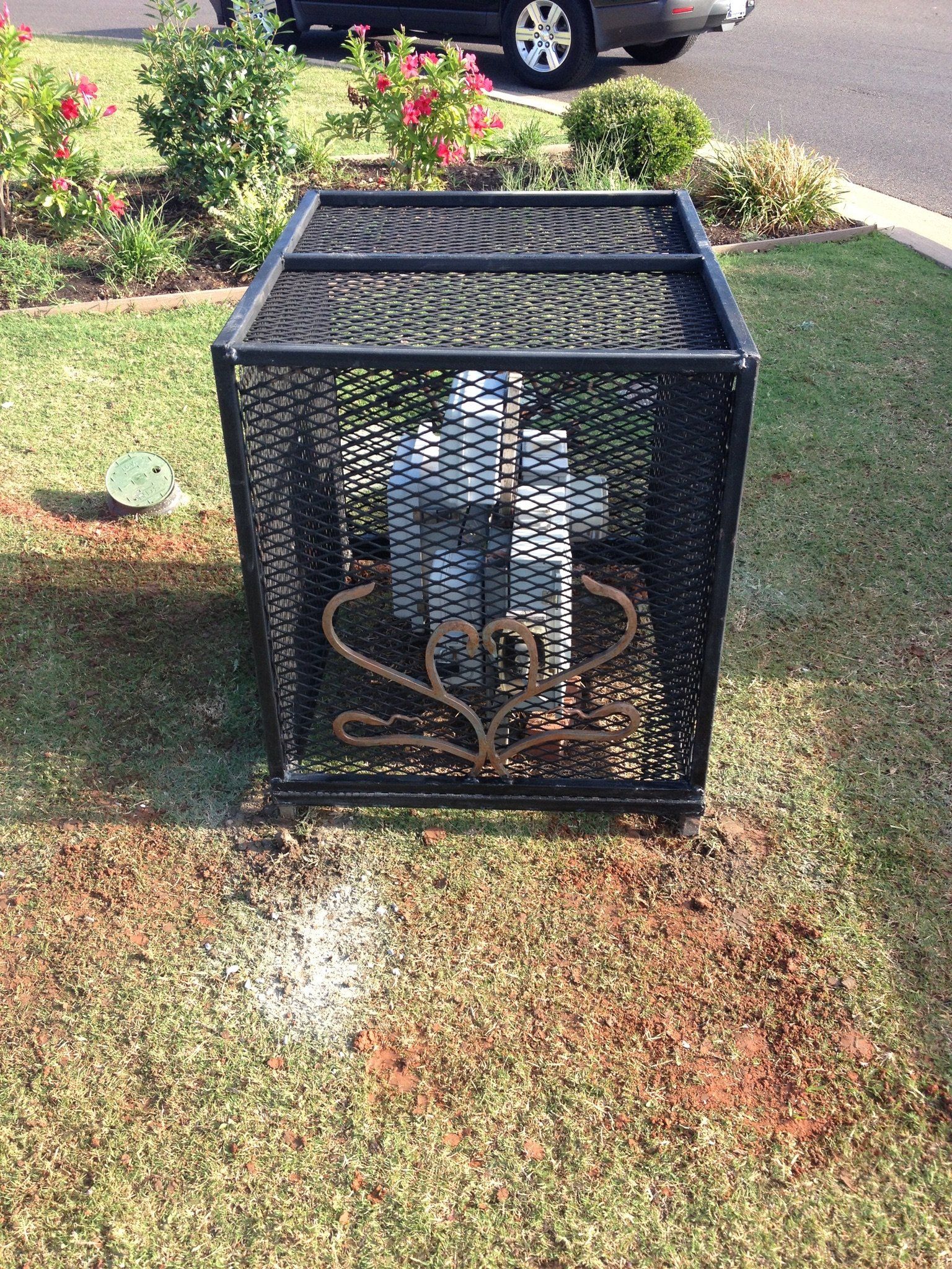 Ornamental iron cover cage