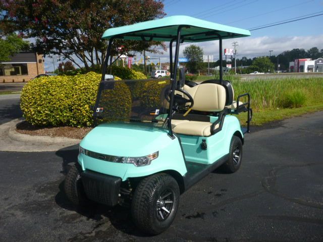 A red golf cart with a canopy on top of it on a white background.