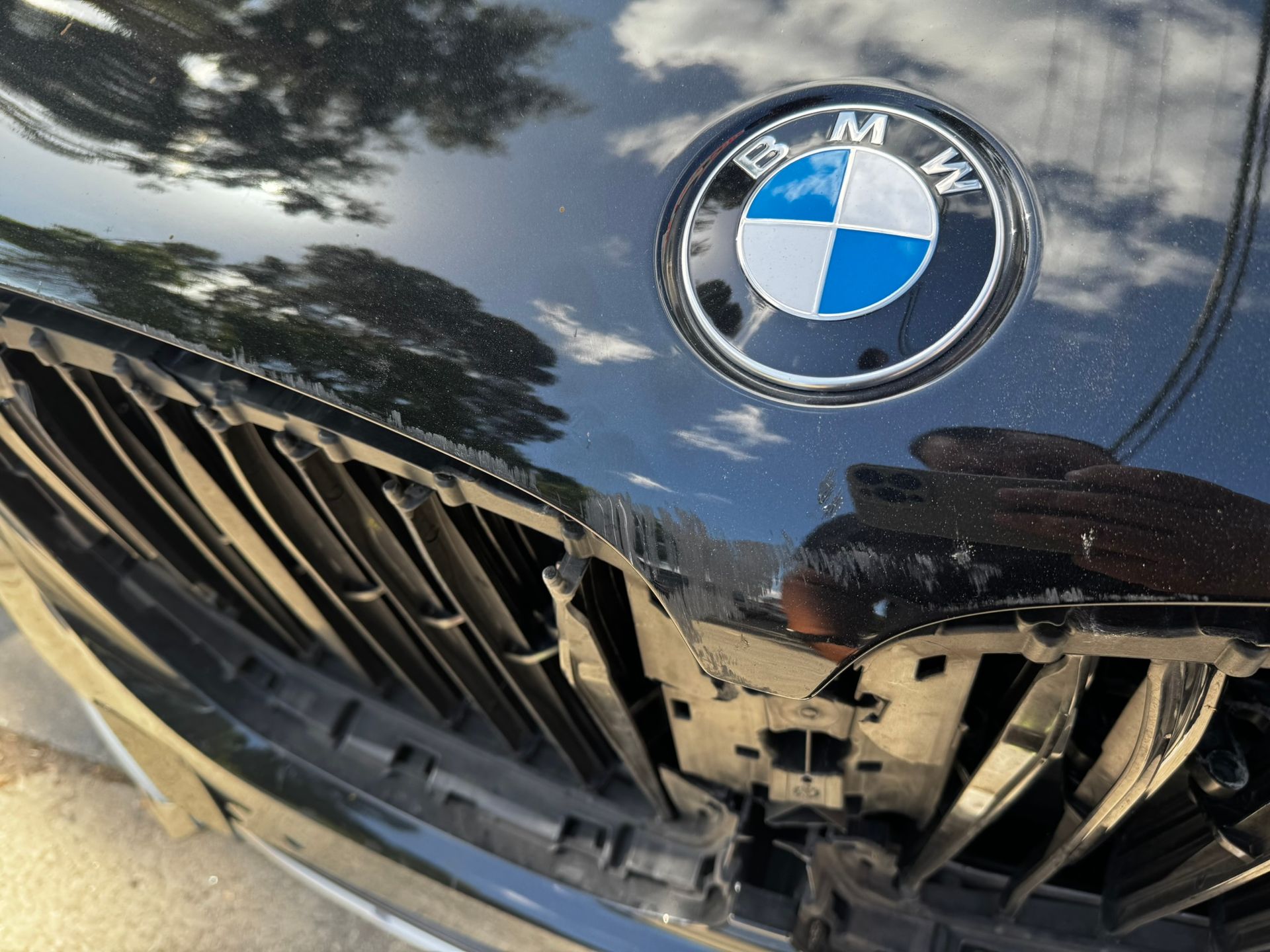 Black BMW car with the logo in focus.