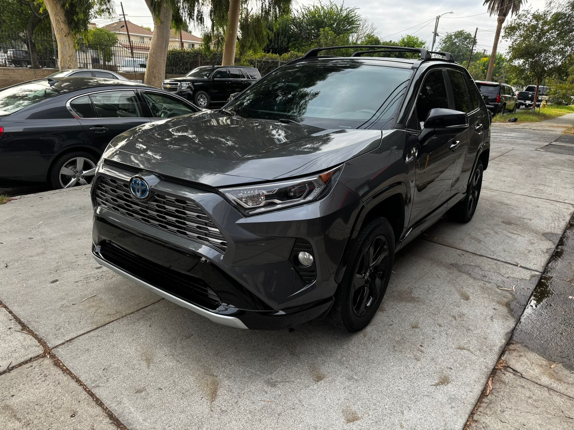 Dark gray Toyota RAV4 parked on a concrete surface.
