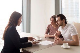Couple talking to an insurance agent