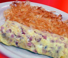 Omelette with meat inside and hash