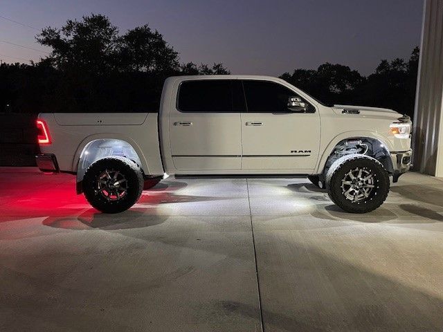 a white truck is parked in a parking lot