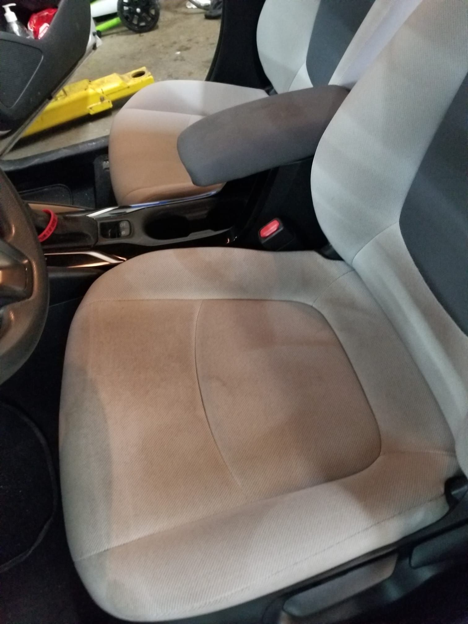 A close up of a car seat in a garage