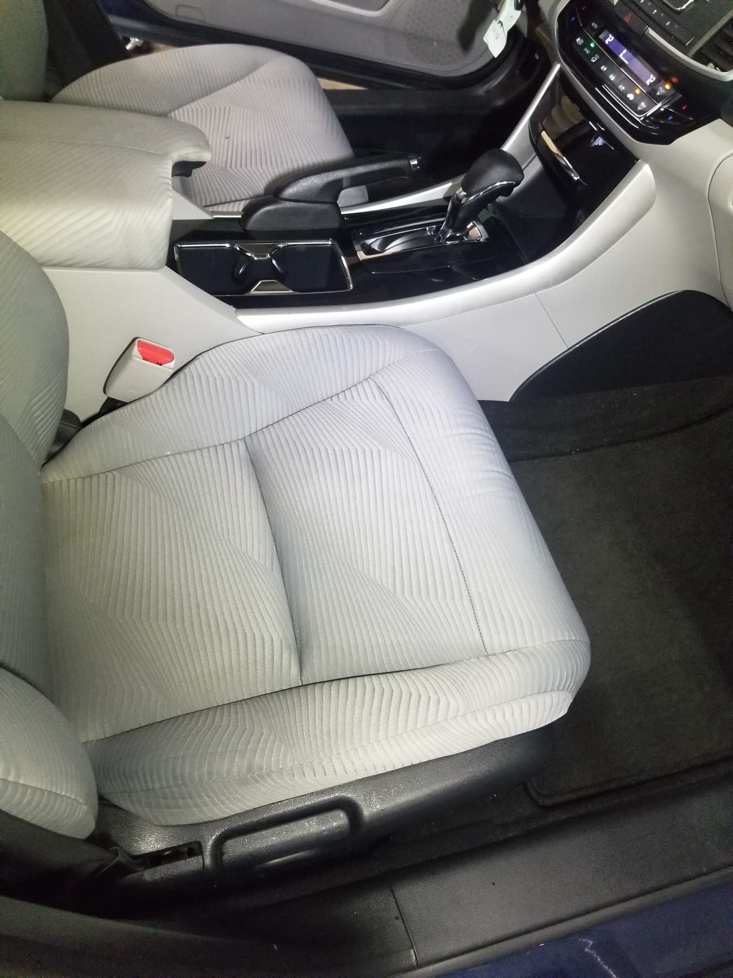 A close up of a car seat in a car