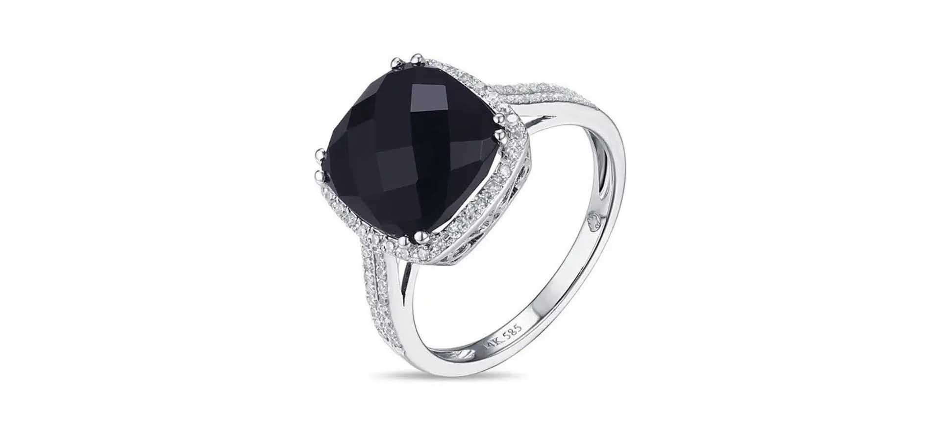 Silver ring with a large black oval gemstone