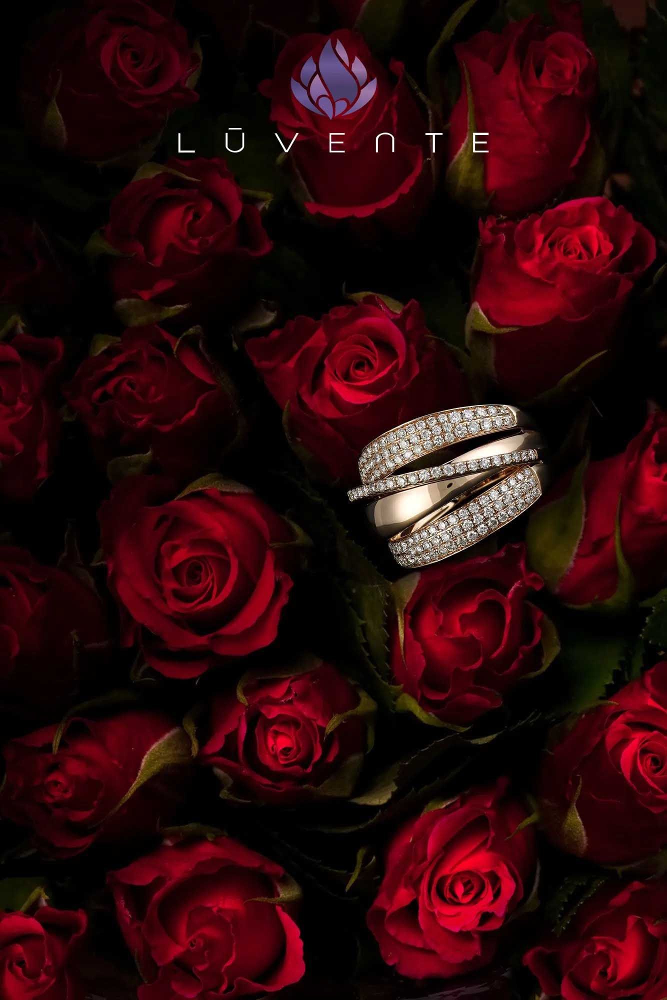 Rose background with a silver ring and the word “LUVENTE” at the top.