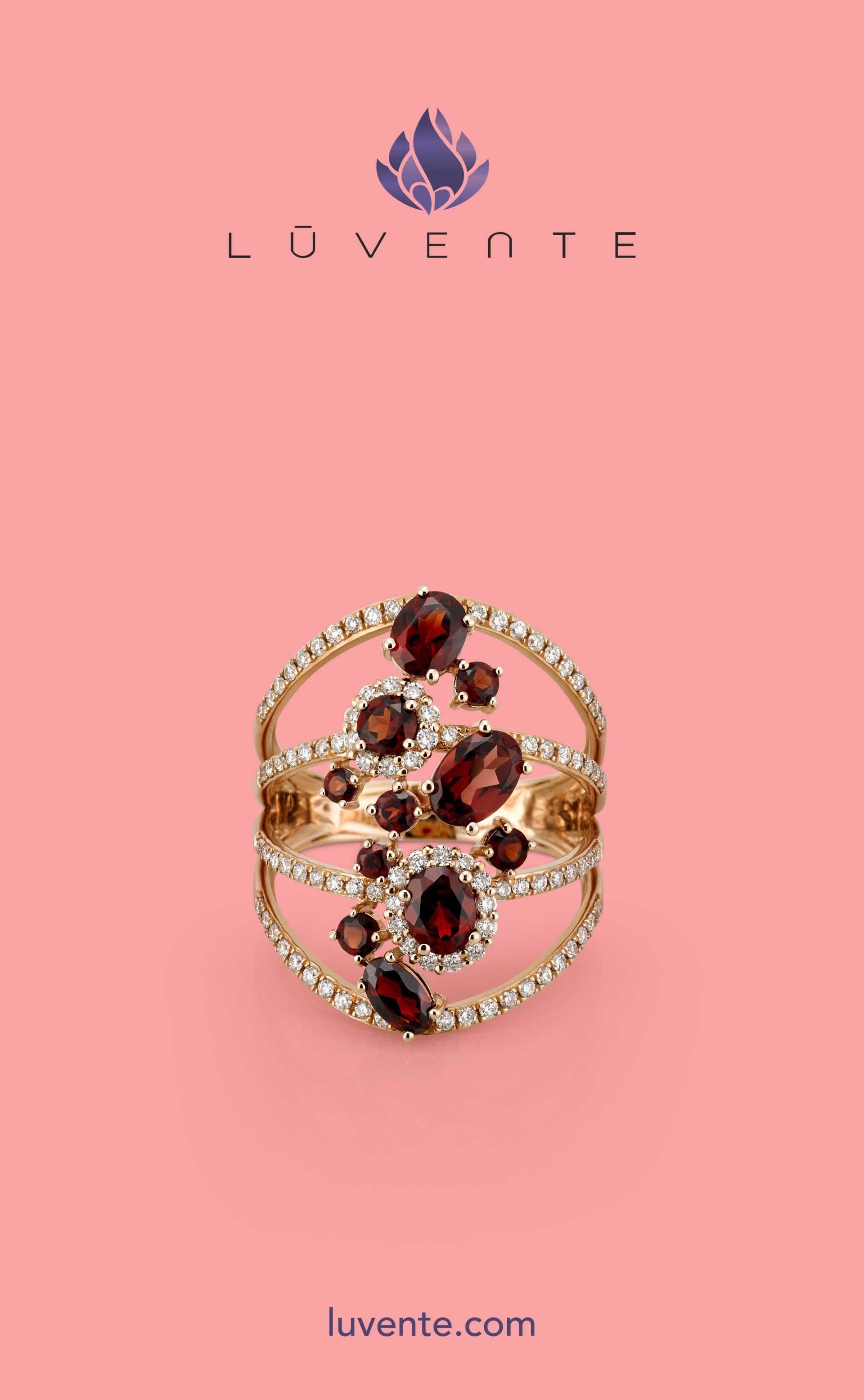 Pink jewelry ad with a gold ring set with dark red gemstones and the Luvnate logo