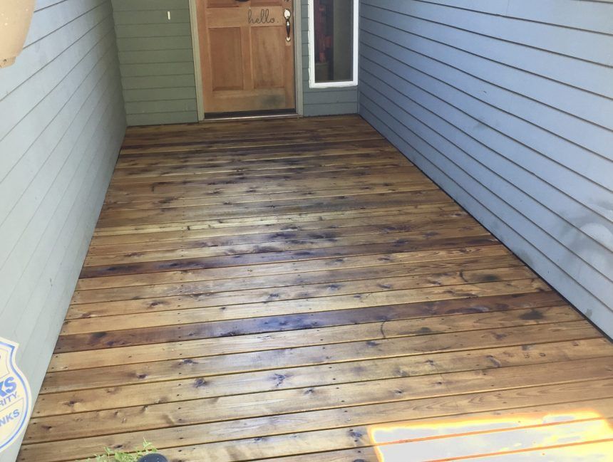A hallway with a wooden floor and a door