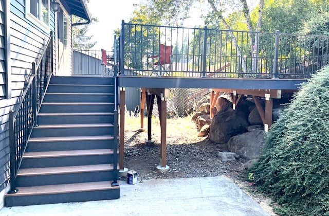 There is a deck with stairs leading up to it.