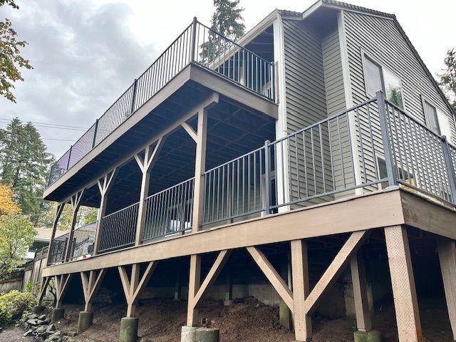 A house with a large deck and a metal railing