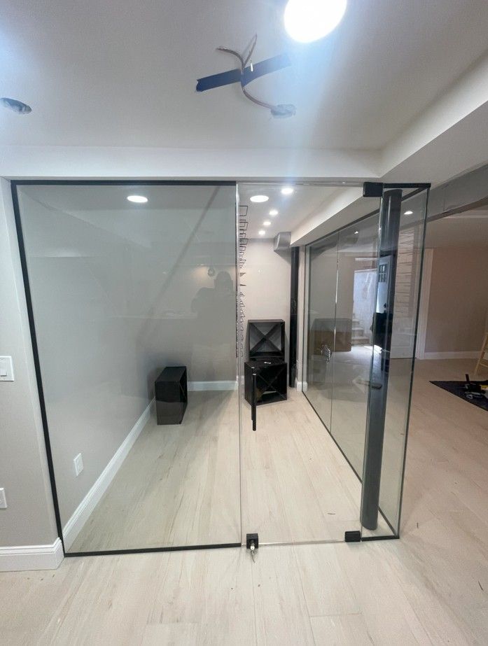 A room with sliding glass doors and a ceiling fan