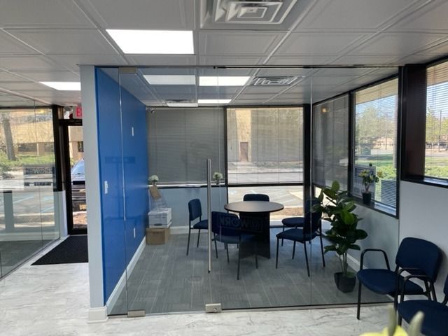 A room with a table and chairs in it