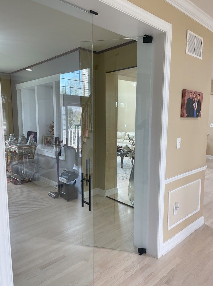 A glass door between two rooms in a house.