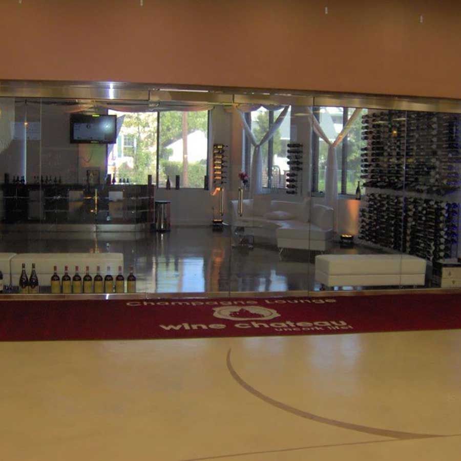 A wine cellar with a red mat that says wine chateau