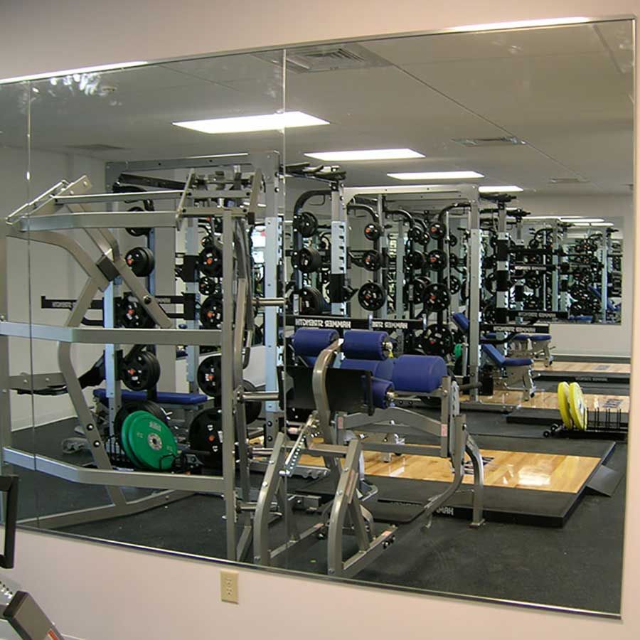 A gym with a large mirror on the wall