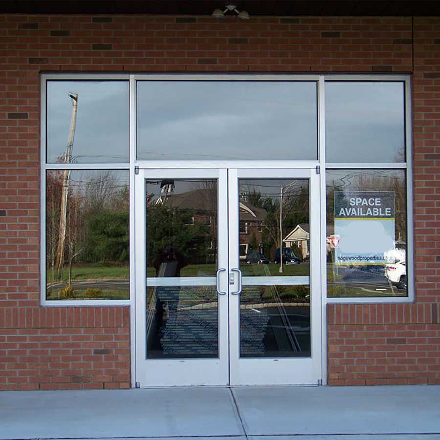 A brick building with a sign that says space available