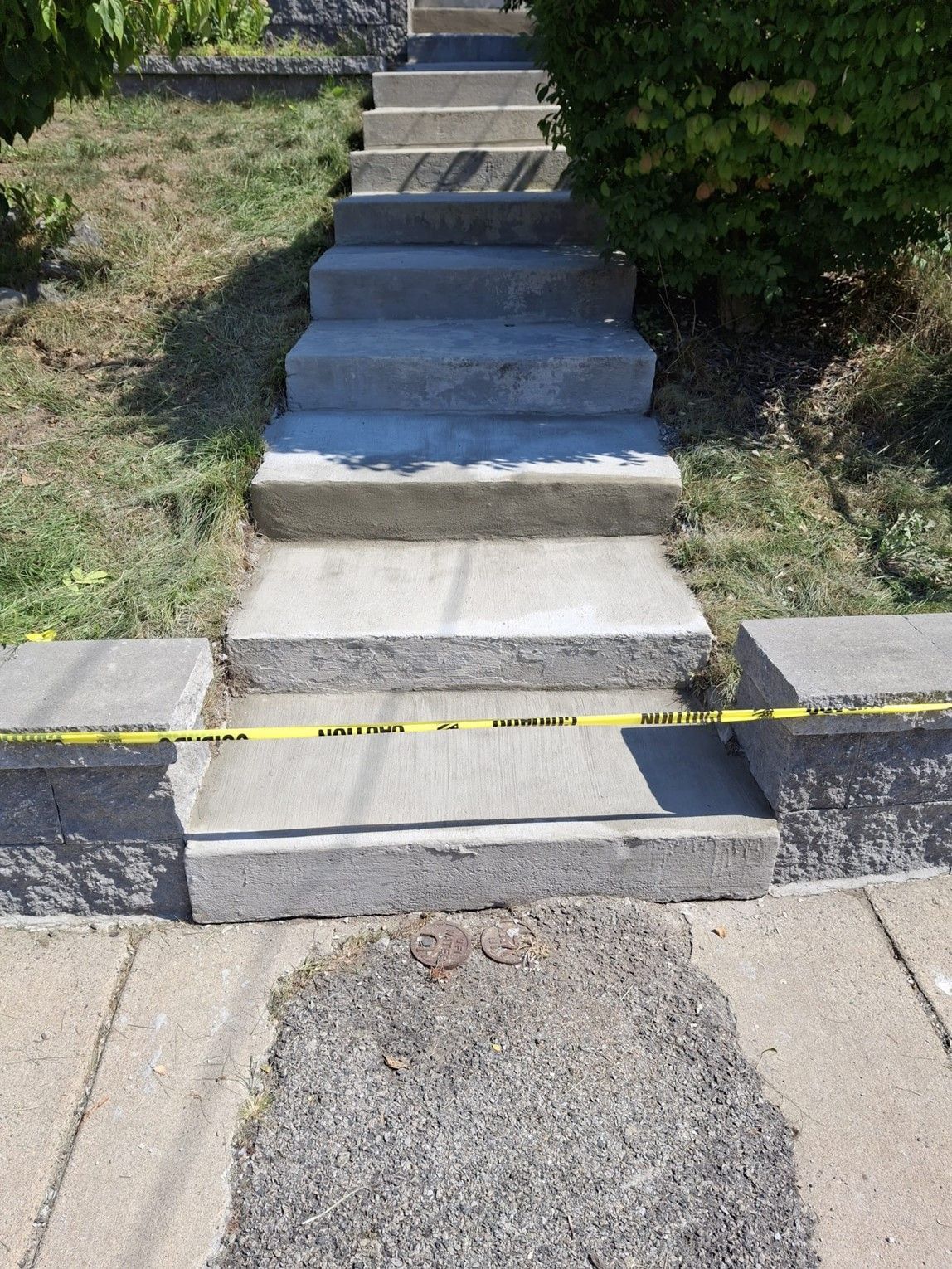 A row of concrete stairs leading up to a house.