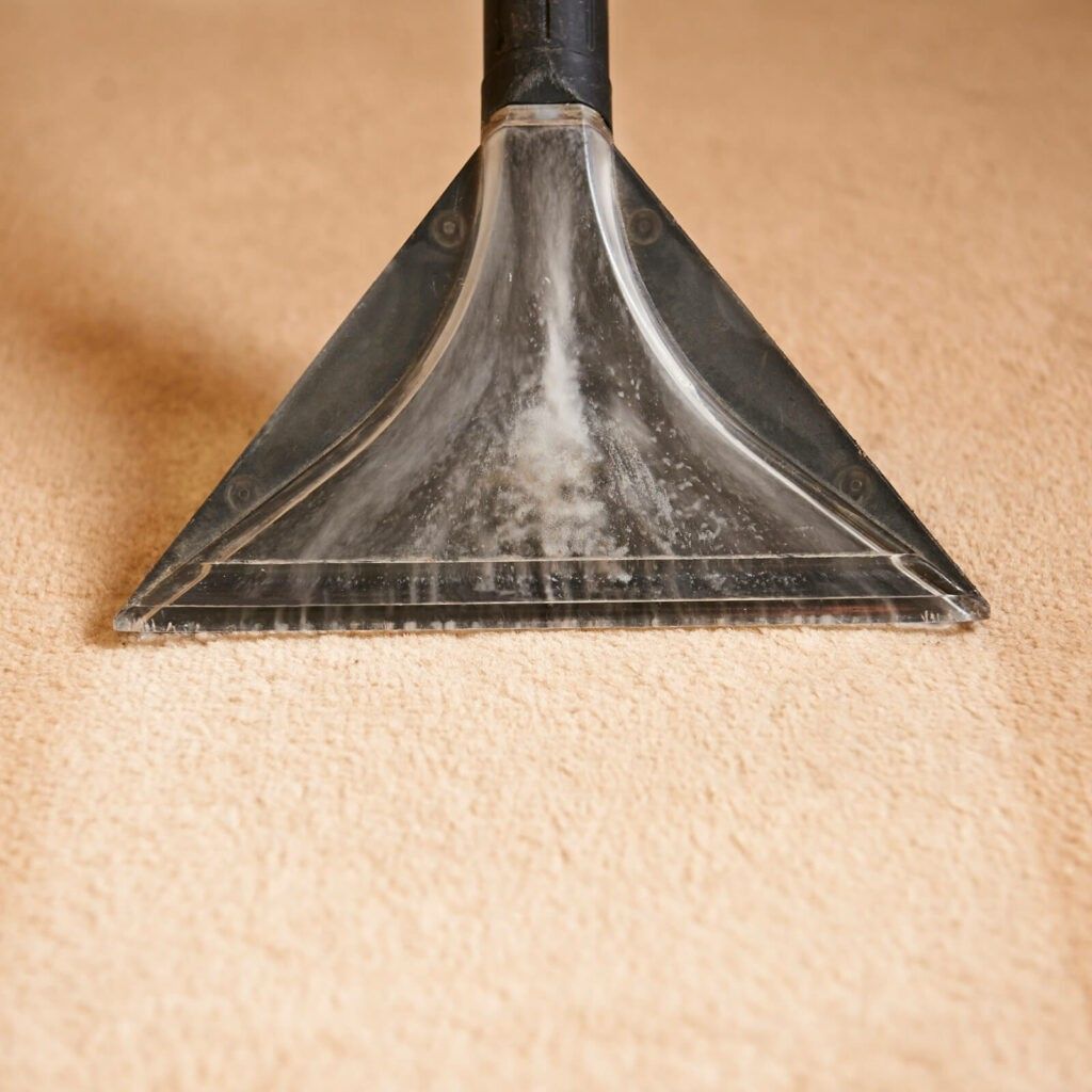 A close up of a vacuum cleaner on a carpet.
