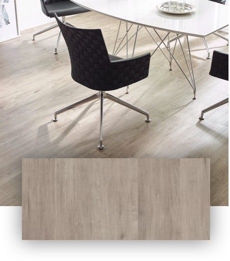 A dining room table and chairs with a wooden floor