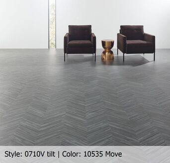 Two chairs and a table on a gray tile floor