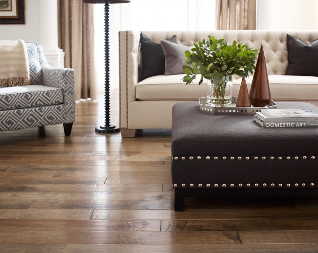 A living room with a couch , chair and coffee table