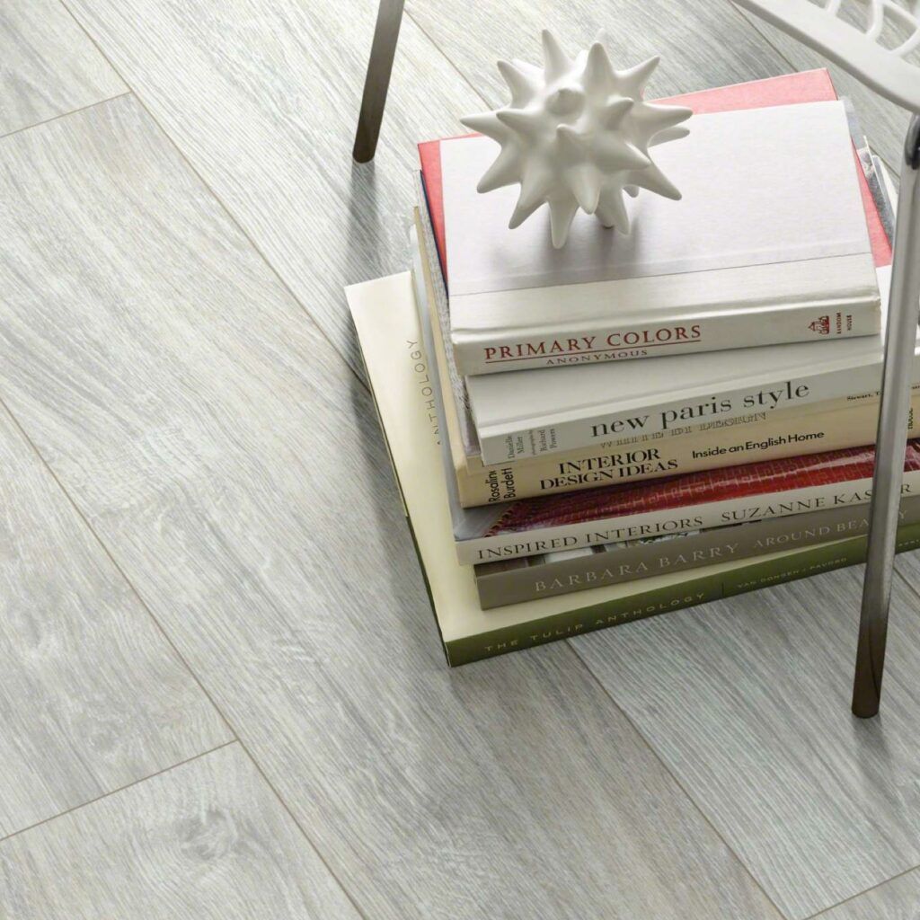 A stack of books including one titled primary colors