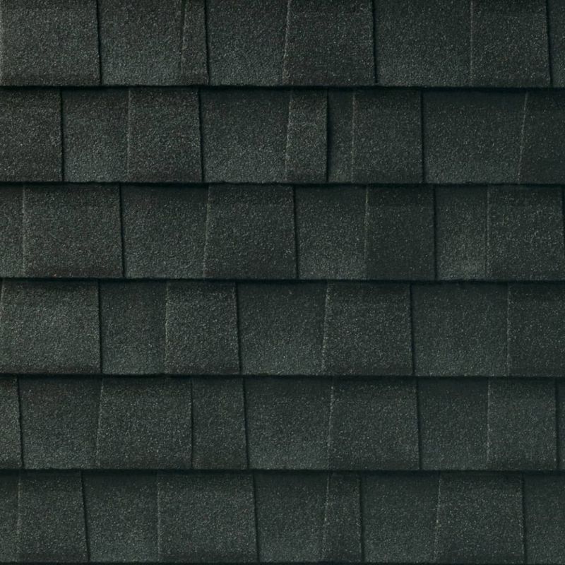 Dark gray asphalt roof shingles.