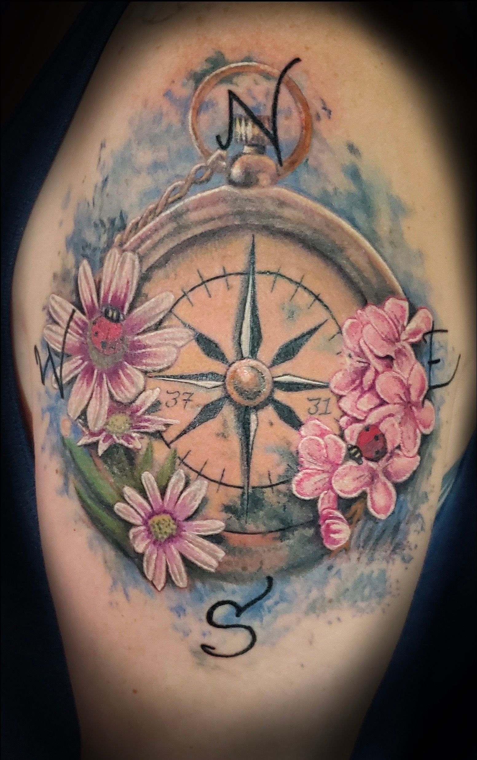 tattoo, tattoo by Melissa Sink, compass tattoo, abstract realism, cardinal directions, flowers
