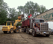 Excavator and truck