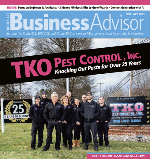 Business Advisor magazine cover featuring TKO Pest Control team in front of a company sign