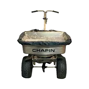 A chapin spreader is sitting on a white surface.