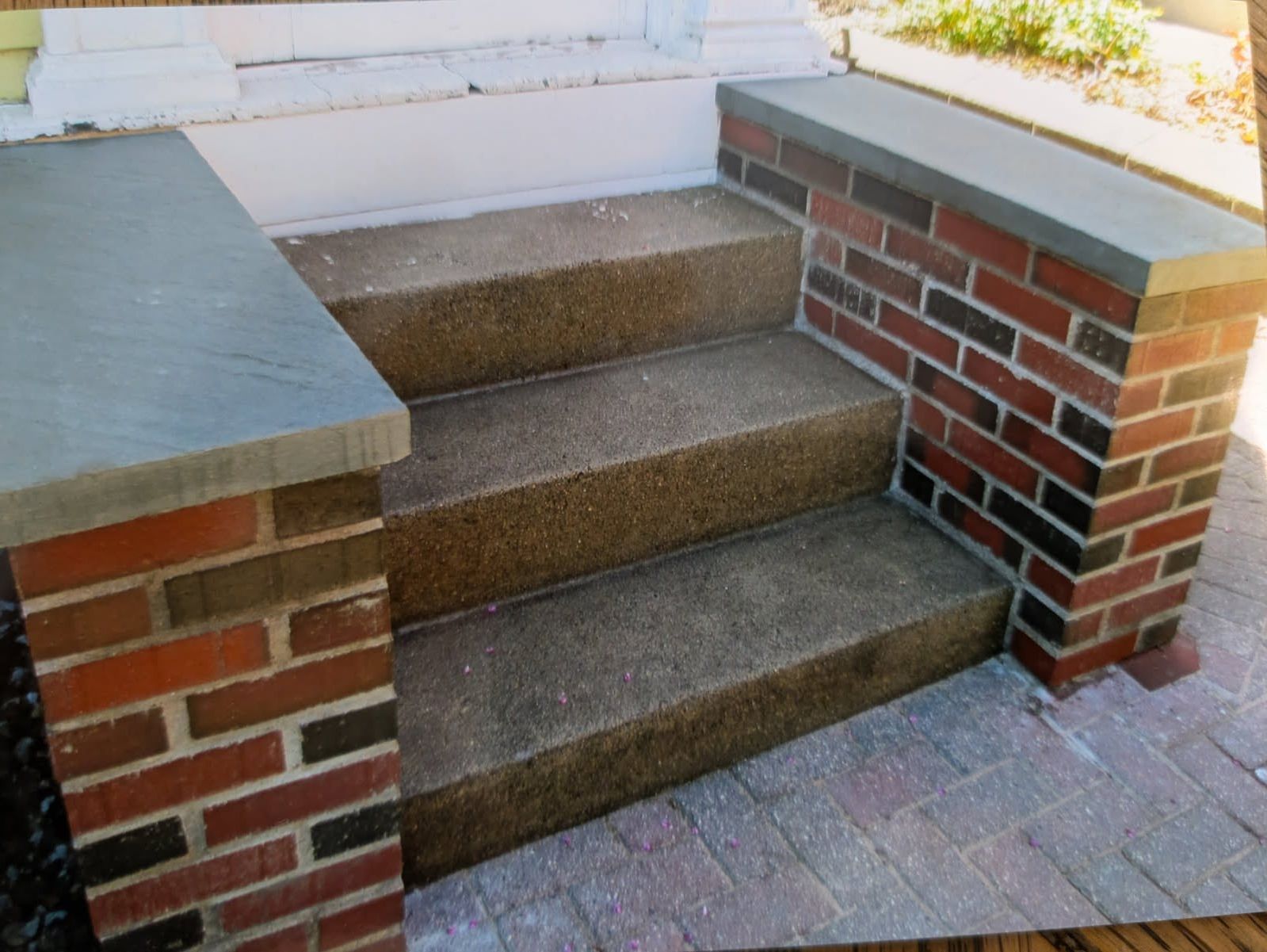A set of stairs built into a brick wall