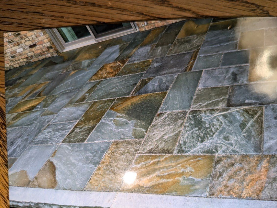 A picture of a tiled floor on a wooden table.