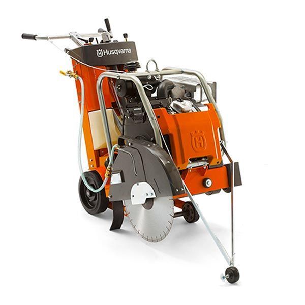 Orange Husqvarna concrete saw with a silver blade, ready to cut.