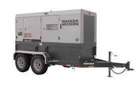 Gray and white Wacker Neuson generator on a trailer, likely for construction or power needs.
