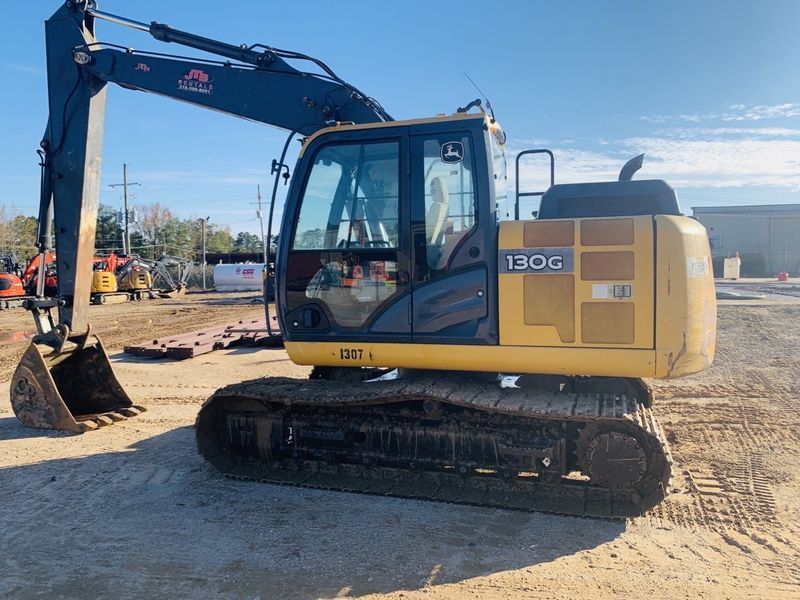 Yellow and black excavator machine on a construction site.