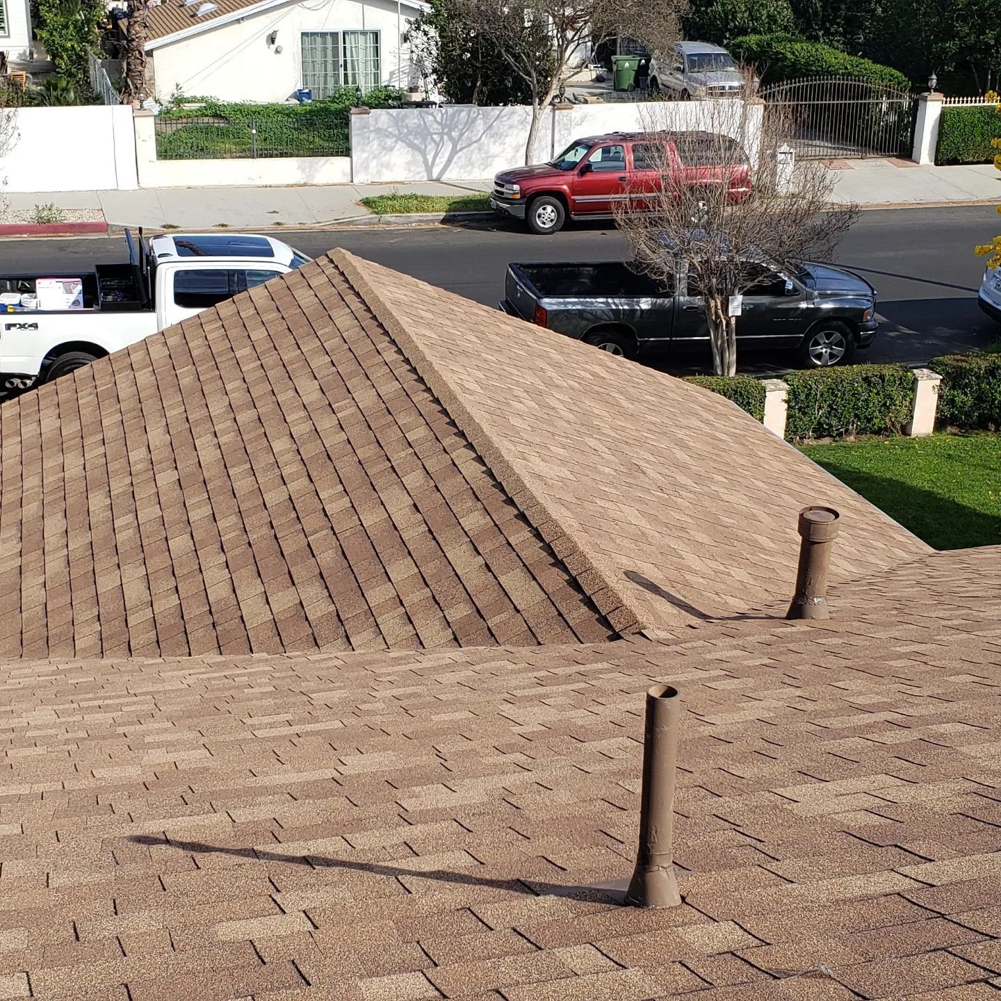 A tiled roof with a chimney on top of it