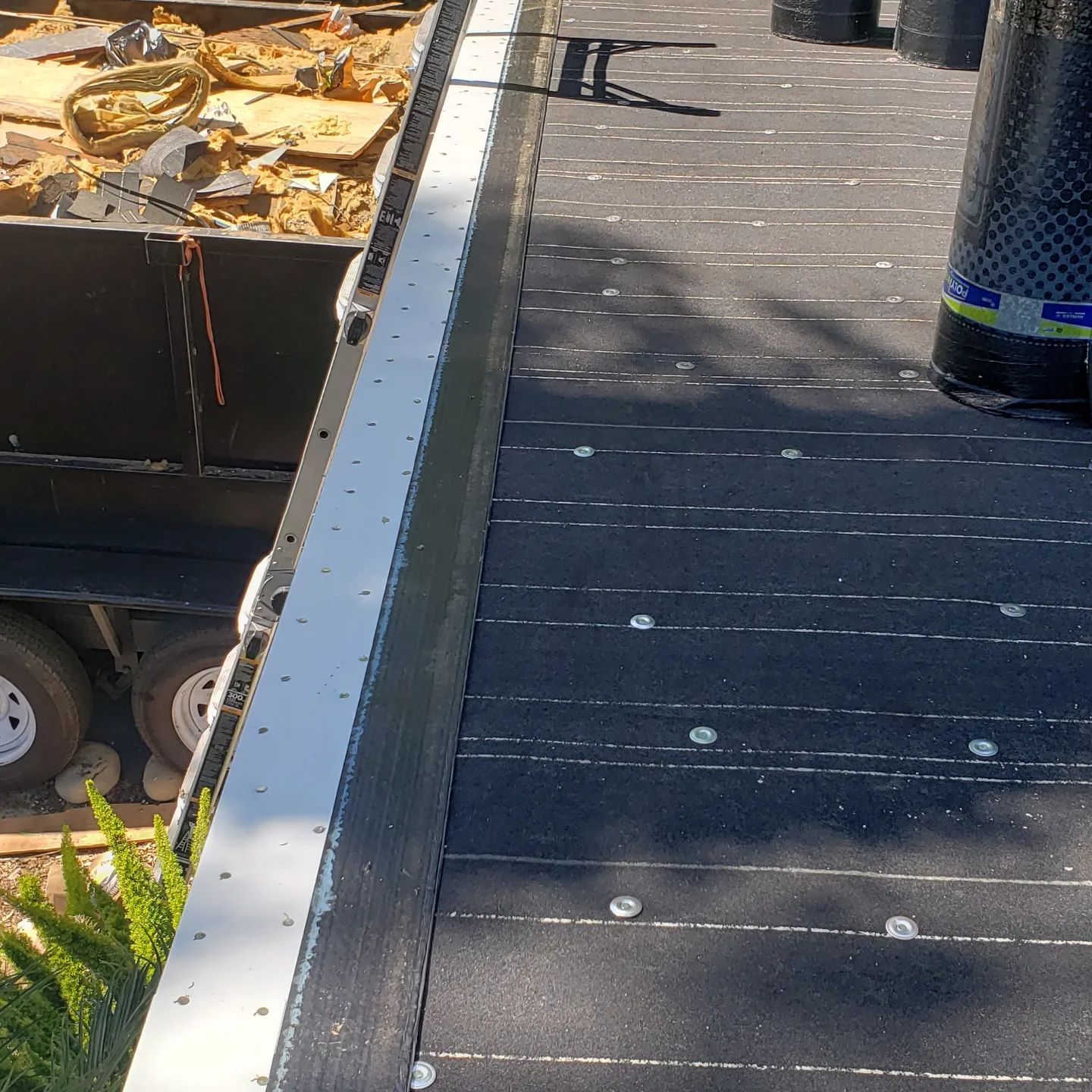 A house with a wooden roof is under construction