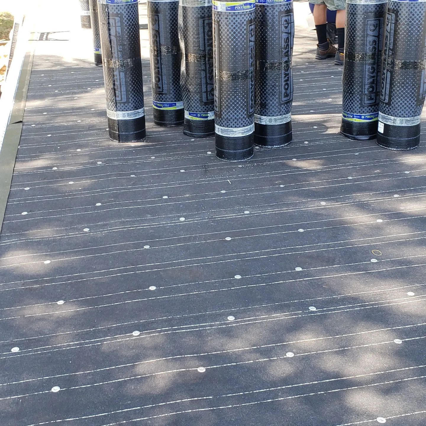 A brown roof with a chimney on top of it