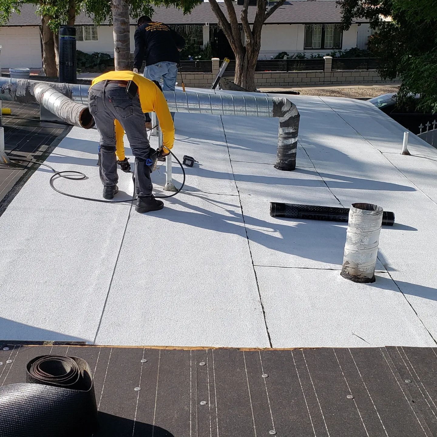 An aerial view of a roof of a house with a chimney