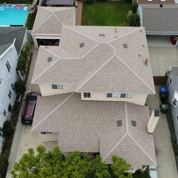 A close up of a roof with a blue sky in the background.