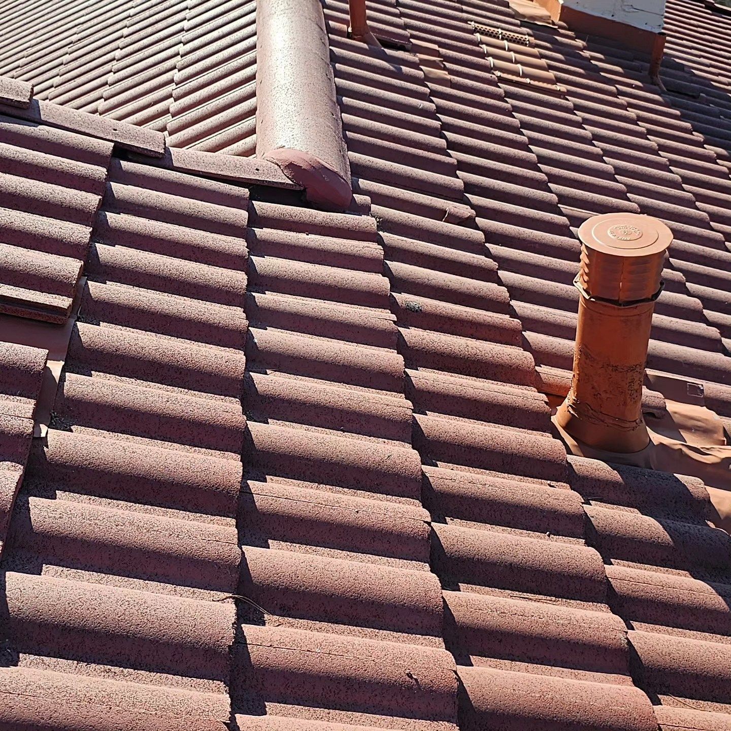 A house with a roof that has a skylight on it.