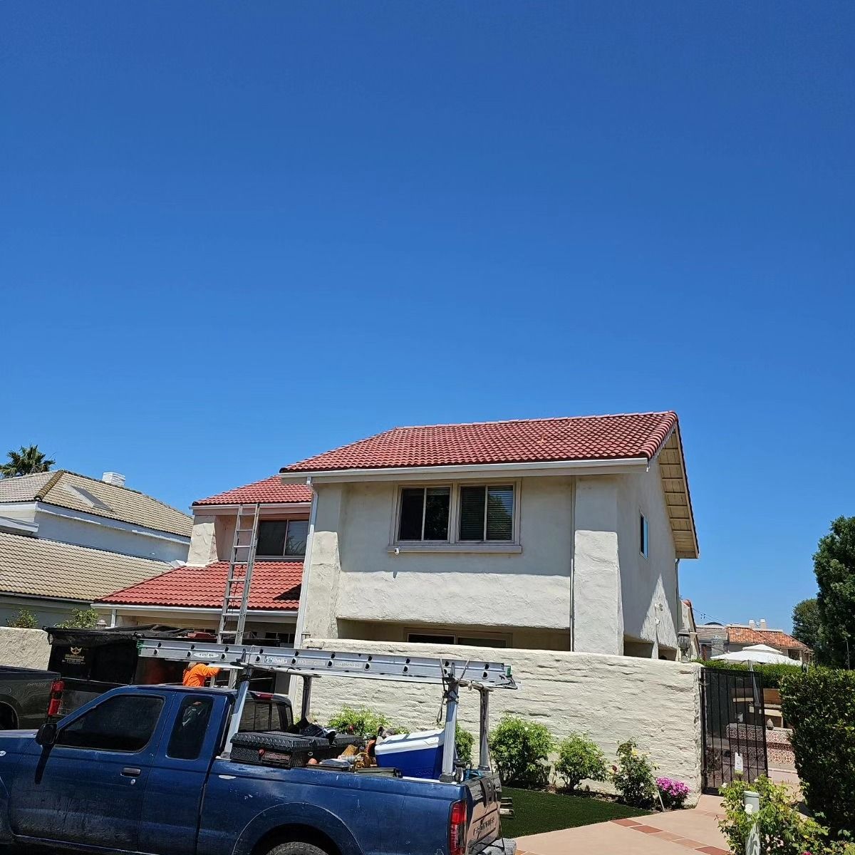 A car is parked in front of a large piece of wood