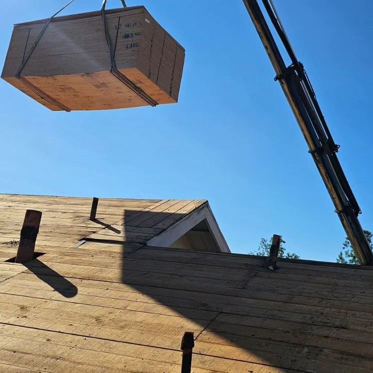 A white ford truck is parked in front of a house