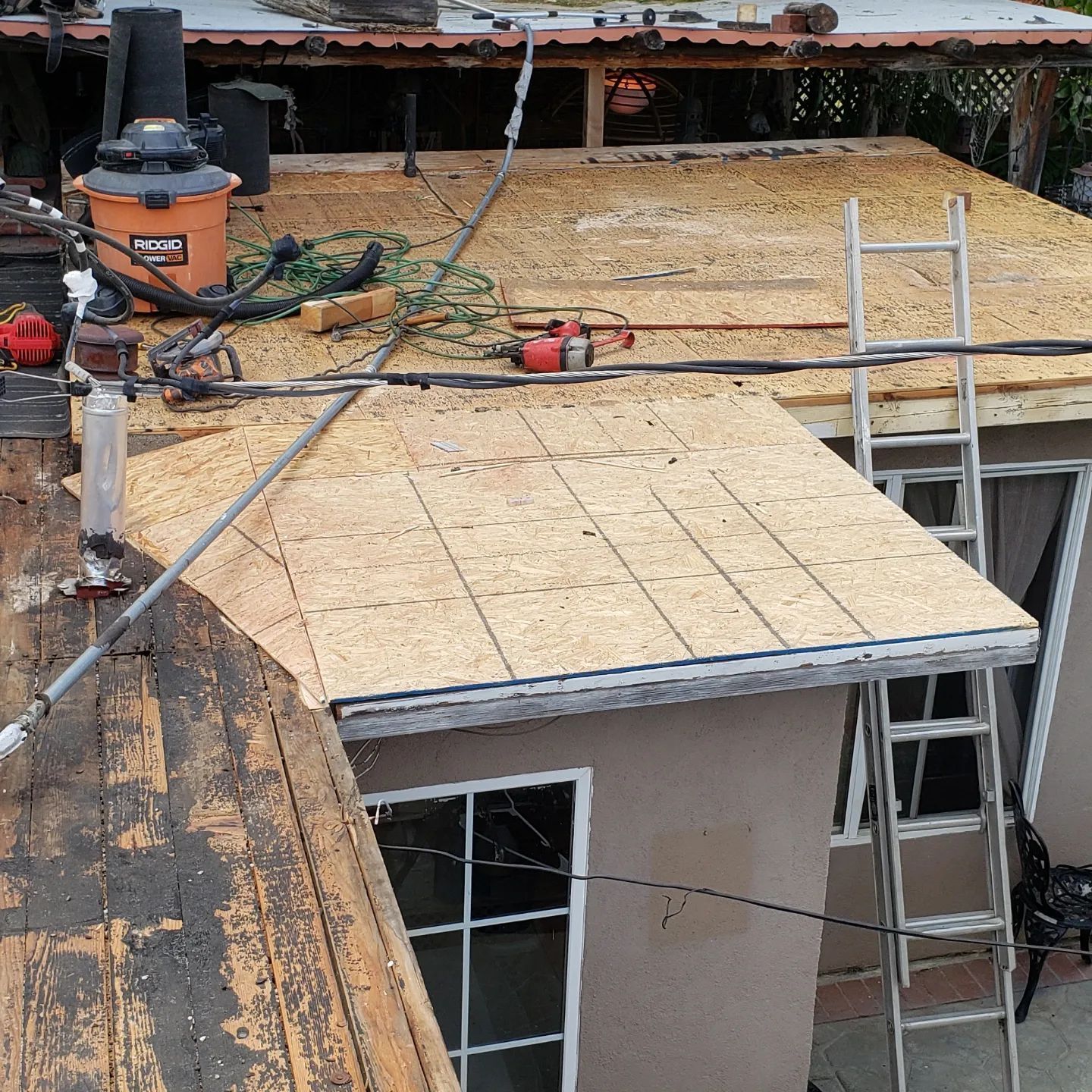 A chimney sits on top of a tiled roof